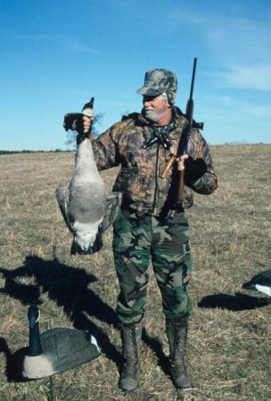 Hunter with Canada goose