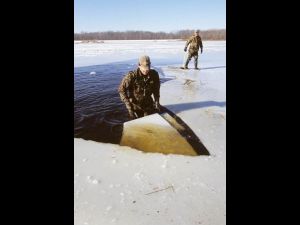 chopping ice for setting decoys